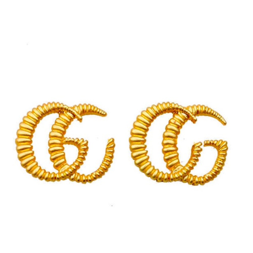 NWT gold plated statement designer studs